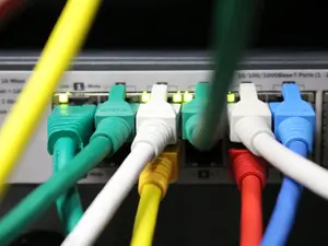 A picture of colorful cables that are plugged into a technical device