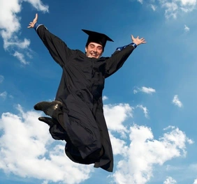 Illustration of a jubilant doctoral candidate wearing a doctoral hat jumping into the air in front of a blue sky with a white cloud.