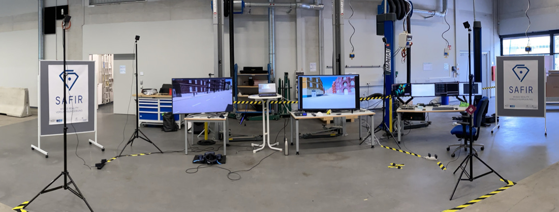 Illustration of an experimental set-up with two screens and SAFIR posters left and right