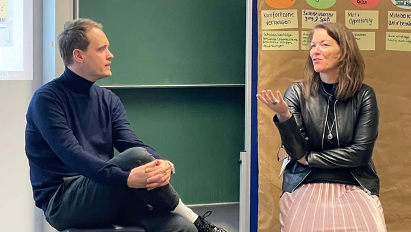 Two people are talking.