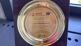 A golden round plaque that designates Technische Hochschule Ingolstadt as a valuable partner.