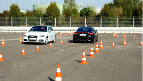 Two vehicles drive on the test track