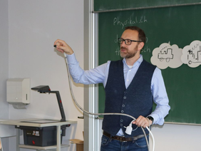 Professor shows endoscope in lecture hall